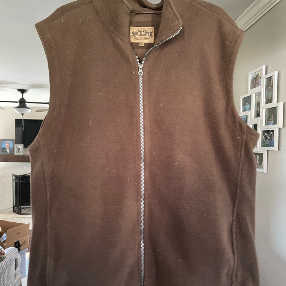Nice fleece vest with pockets and you can make the waist tighter.